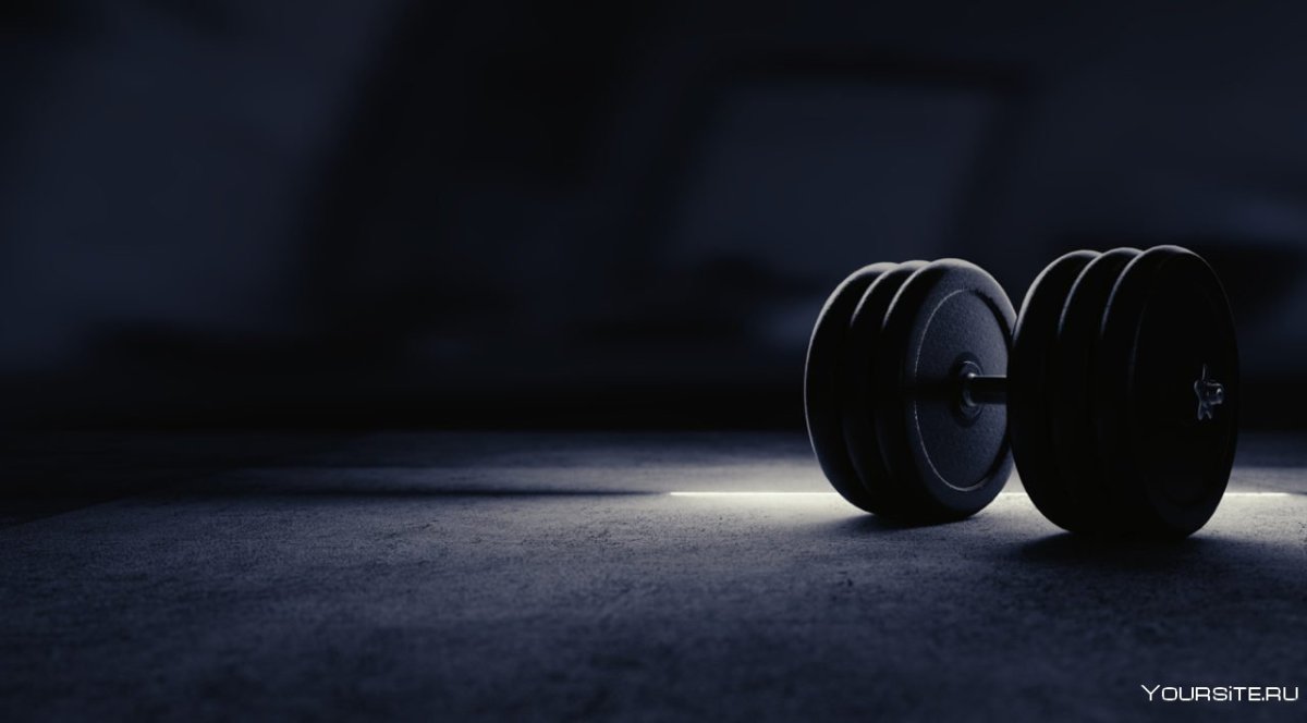Гантели на черном фоне