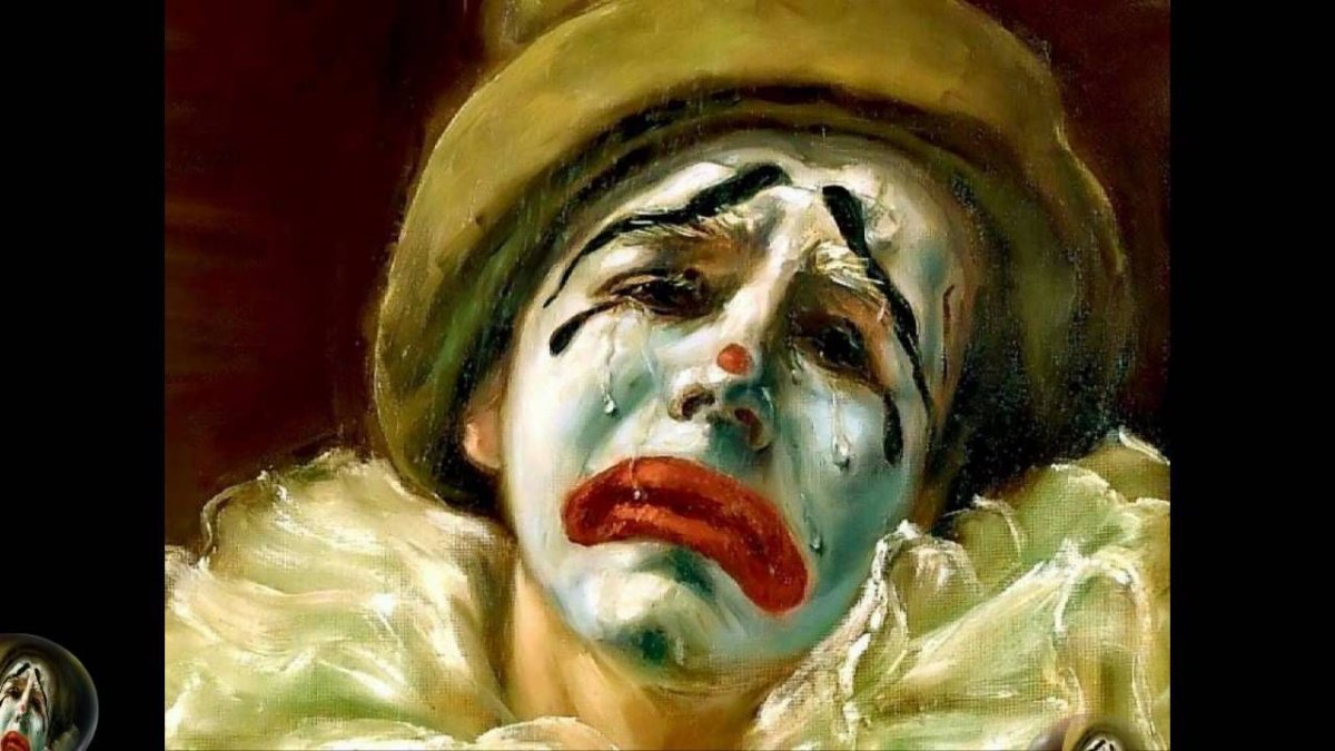 Грустный клоун с сигаретой